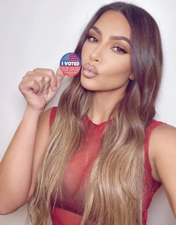 Kim Kardashian's red dress in her voting pic sparks controversy.